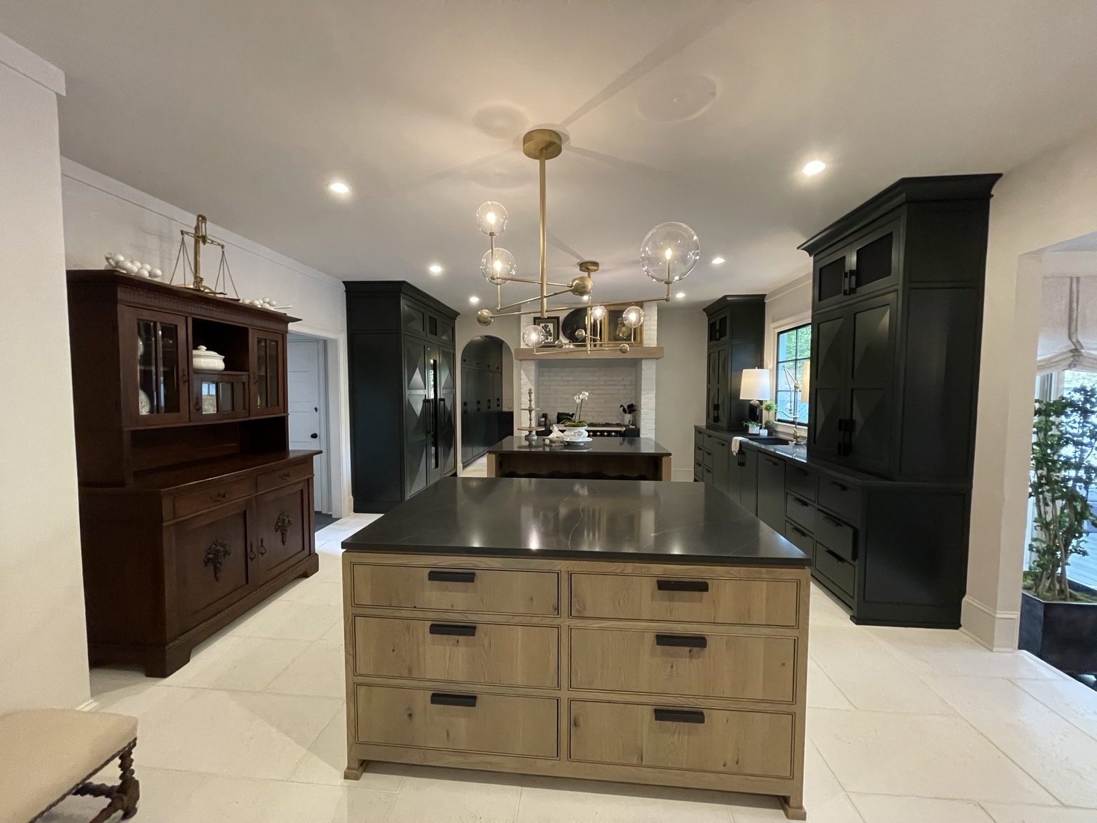 Black + natural oak cabinetry completed by Wave Renovation